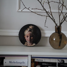 Oil portrait on a round canvas (painted from a photograph)